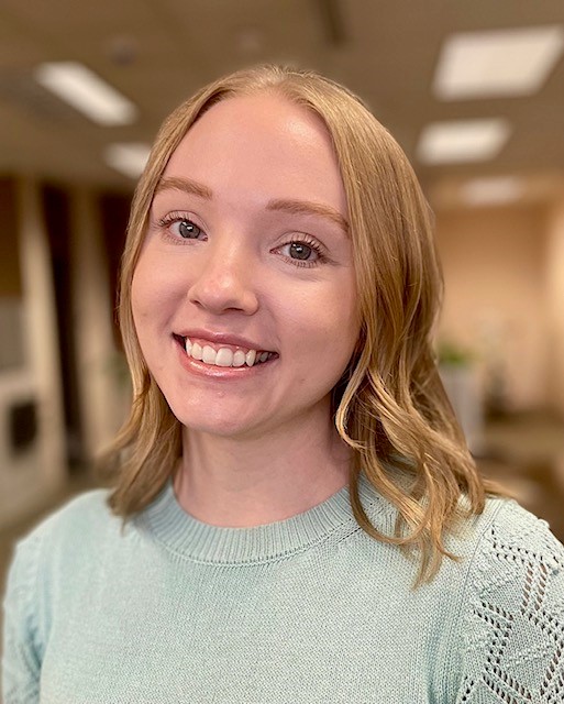 A woman smiling for the camera.