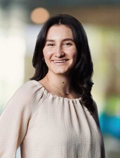 A person smiling at the camera.