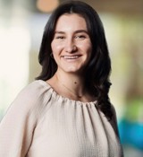 A person smiling at the camera.