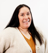 A woman smiling for the camera.