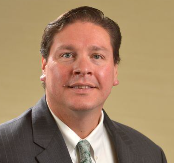 A man wearing a suit and tie.