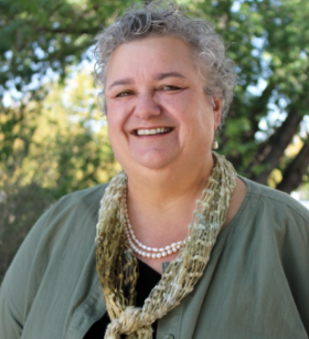 A person smiling for the camera.