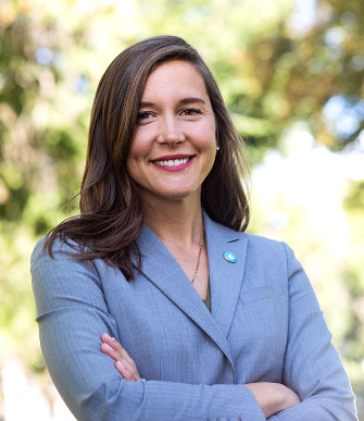 A woman with her arms crossed.