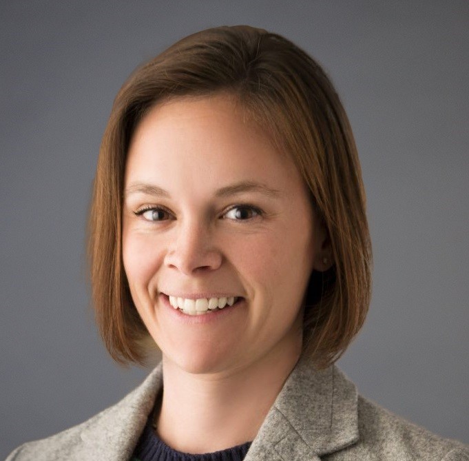 A close-up of a woman smiling.