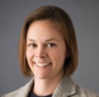 A close-up of a woman smiling.