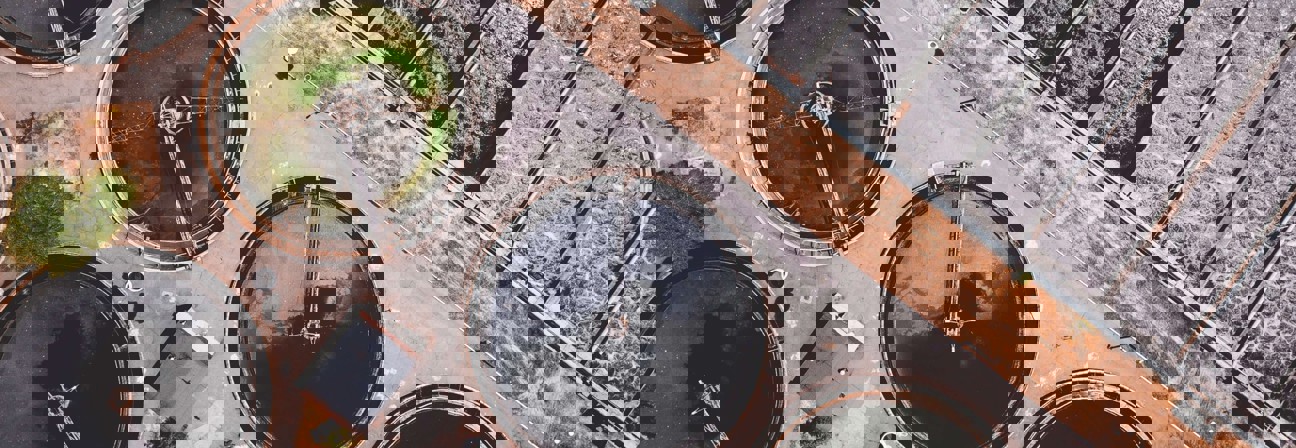 A circular building with a fountain.