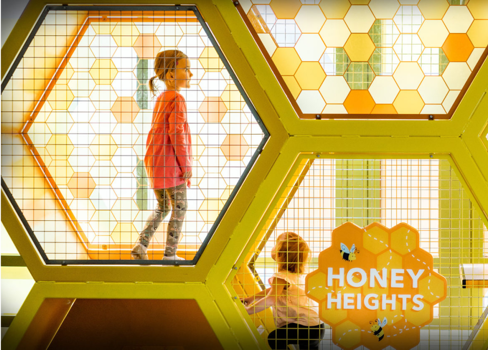 A child in a exhibit in Discovery Gateway.