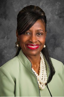 A woman smiling for the camera.