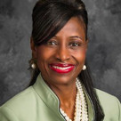 A woman smiling for the camera.