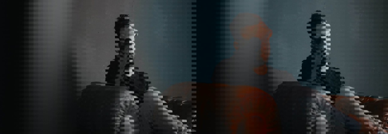 A man sitting on a couch.