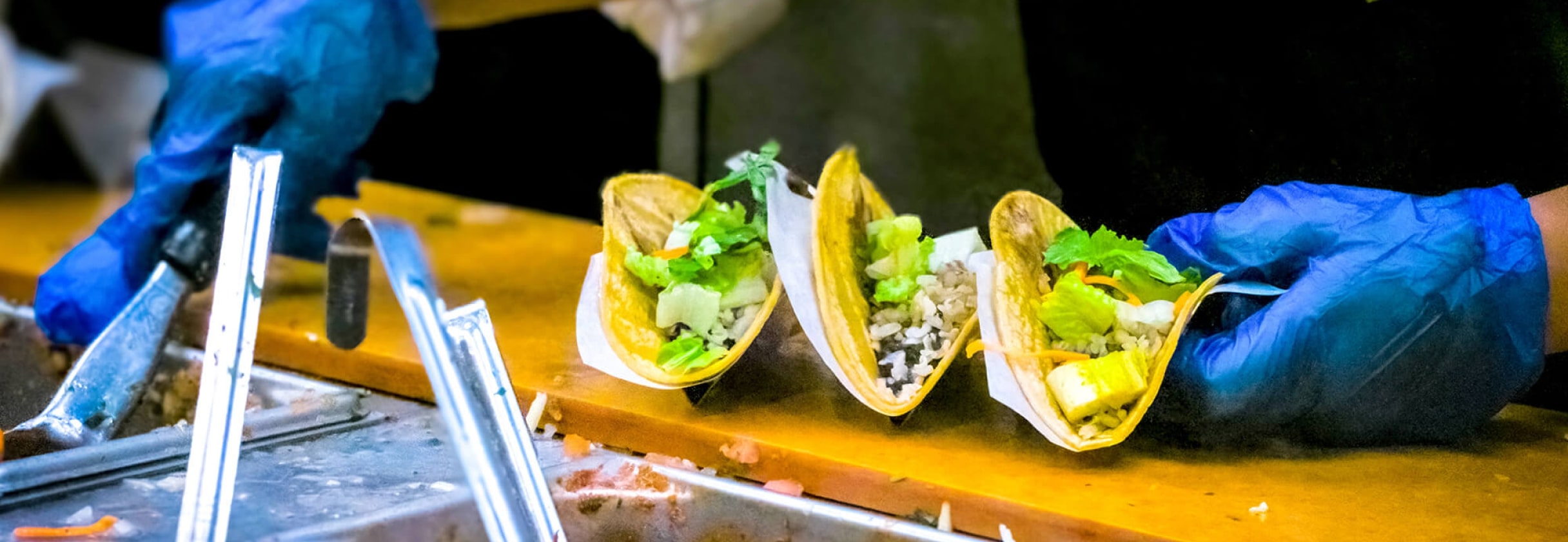 A person holding a tray of food.