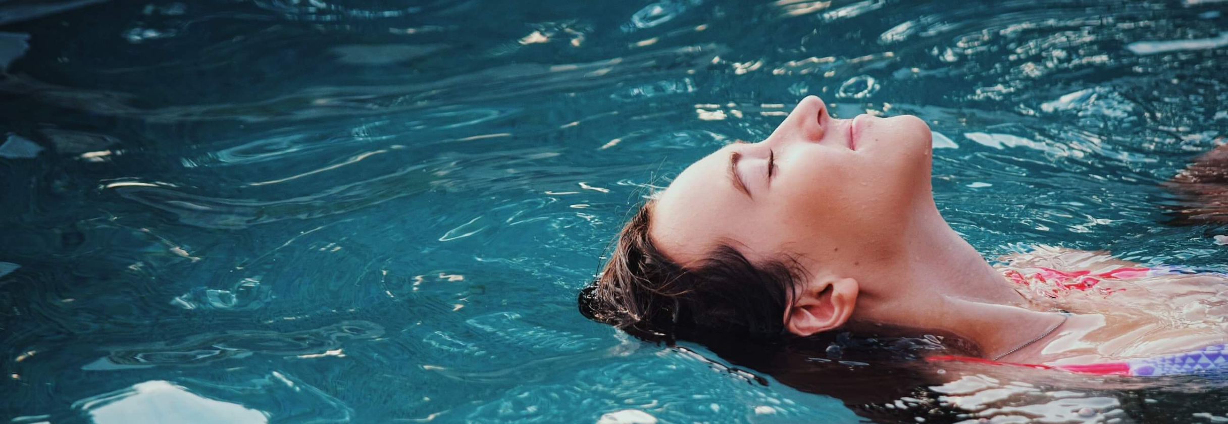A person swimming in water.