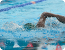 A person swimming in a pool.