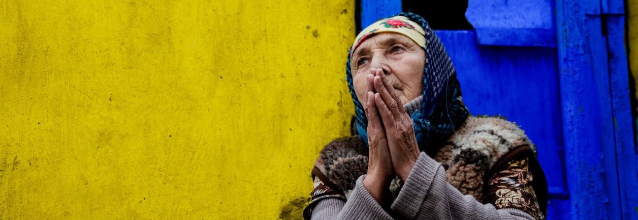 A man with his hand on his face.