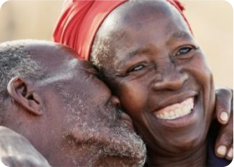 A man and woman smiling.