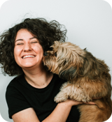 A person holding a dog.