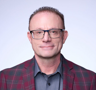 A man wearing glasses.