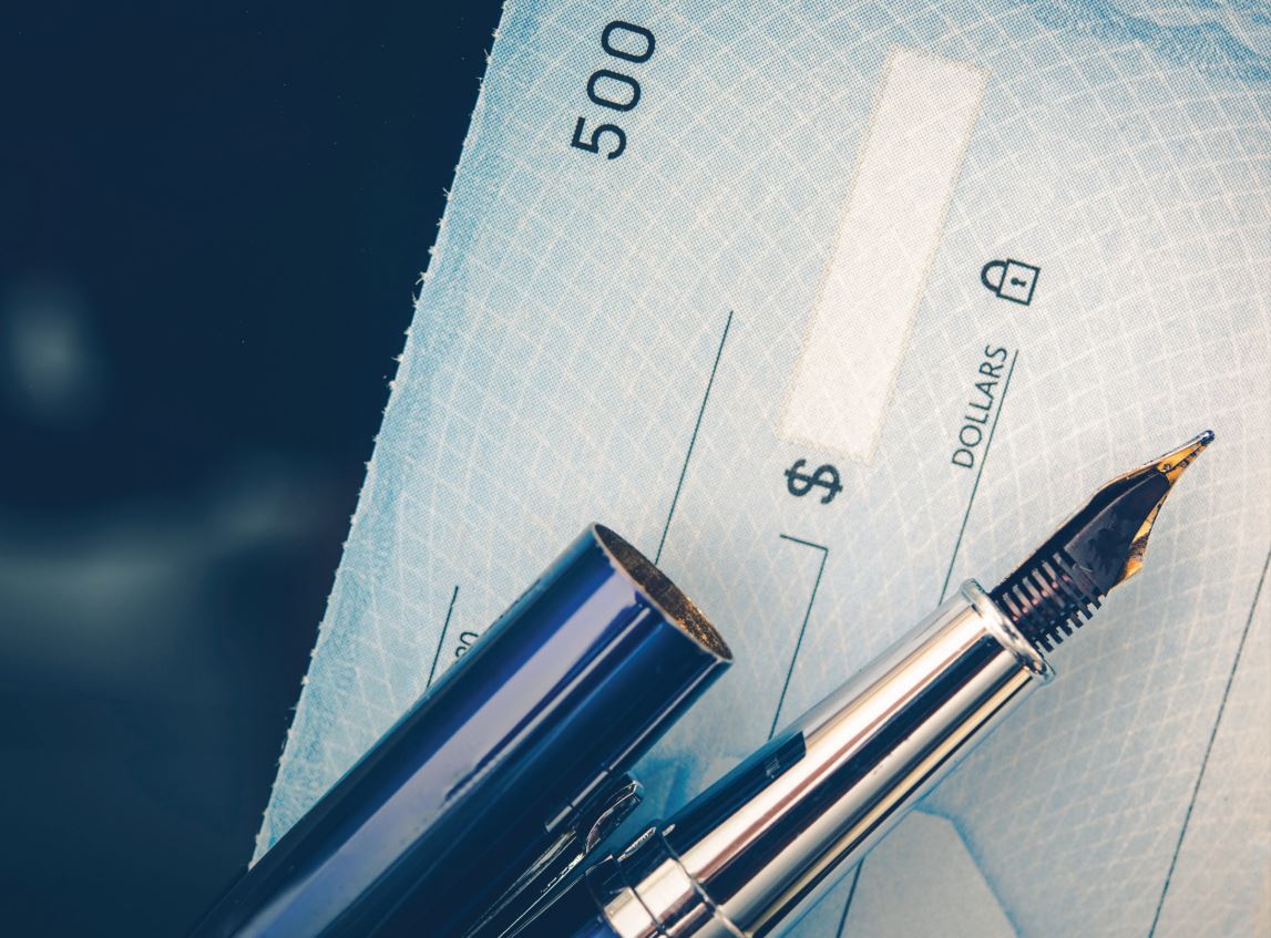 A clock tower with a weather vane.