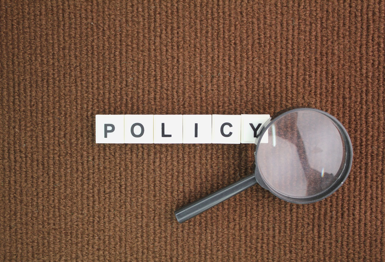 Scrabble pieces that say Policy.