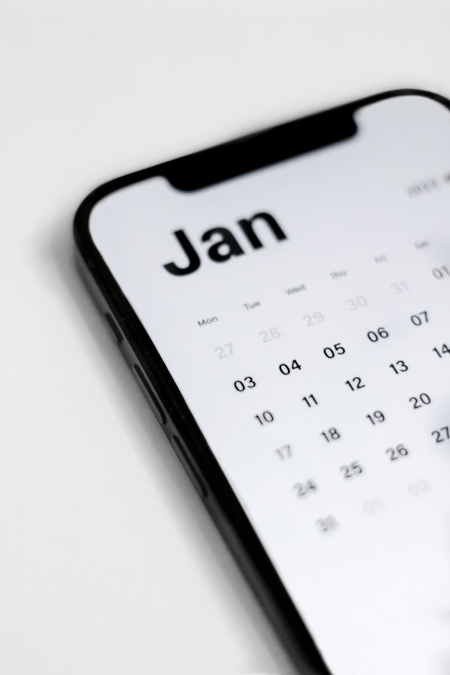 A phone with a calendar that says January.