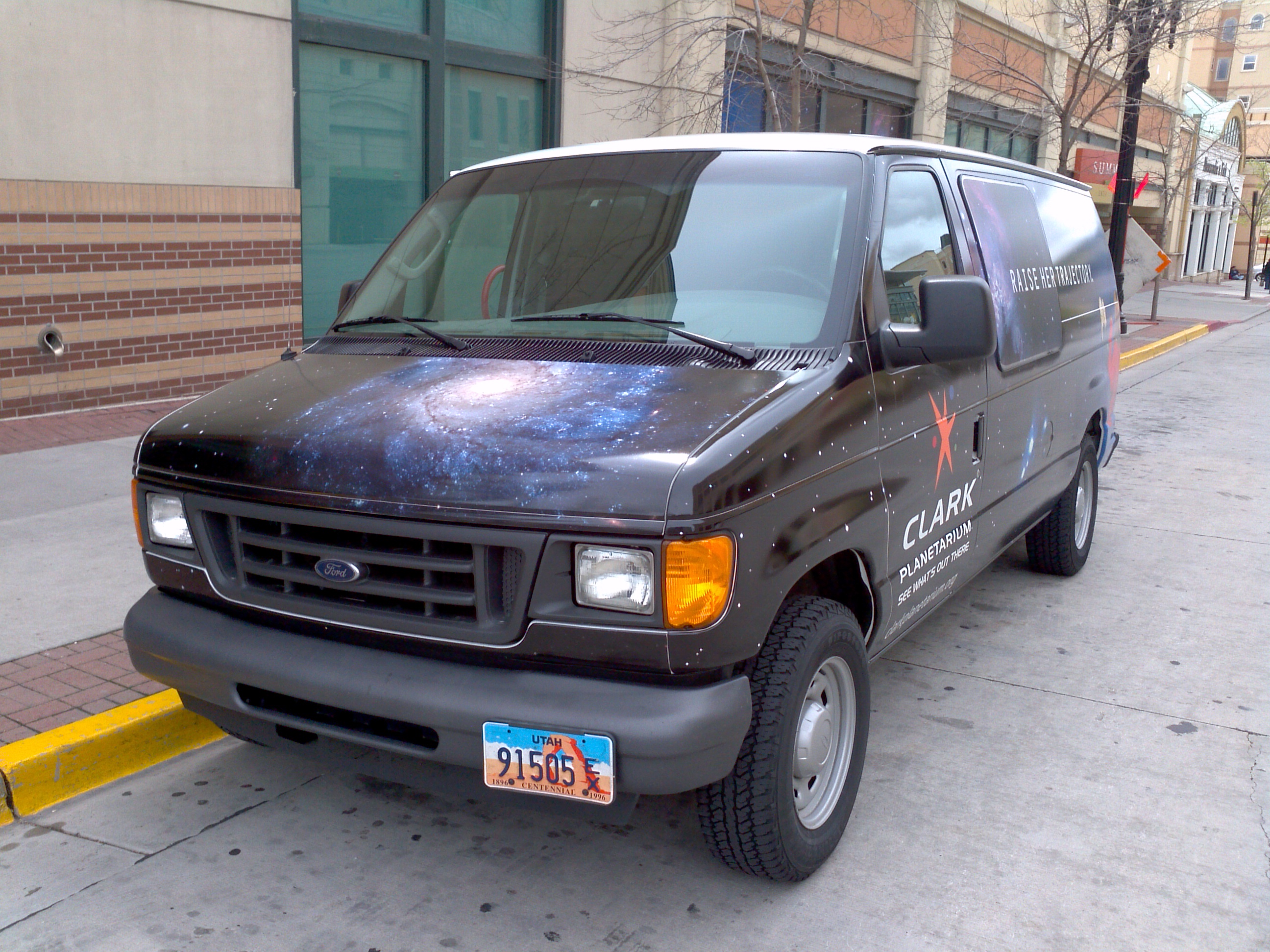 A truck parked on the side of a street.