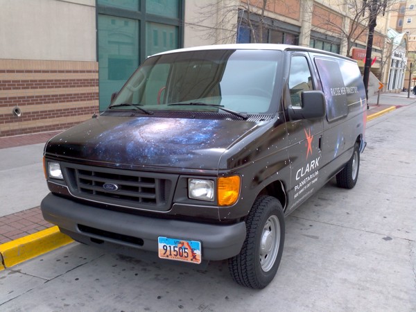 A truck parked on the side of a street.