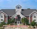 A large building with a flag on the roof.