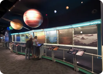 People standing in front of a display.