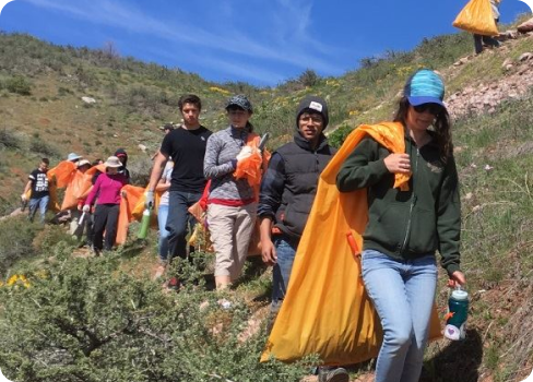 A group of people walking on a trail.
