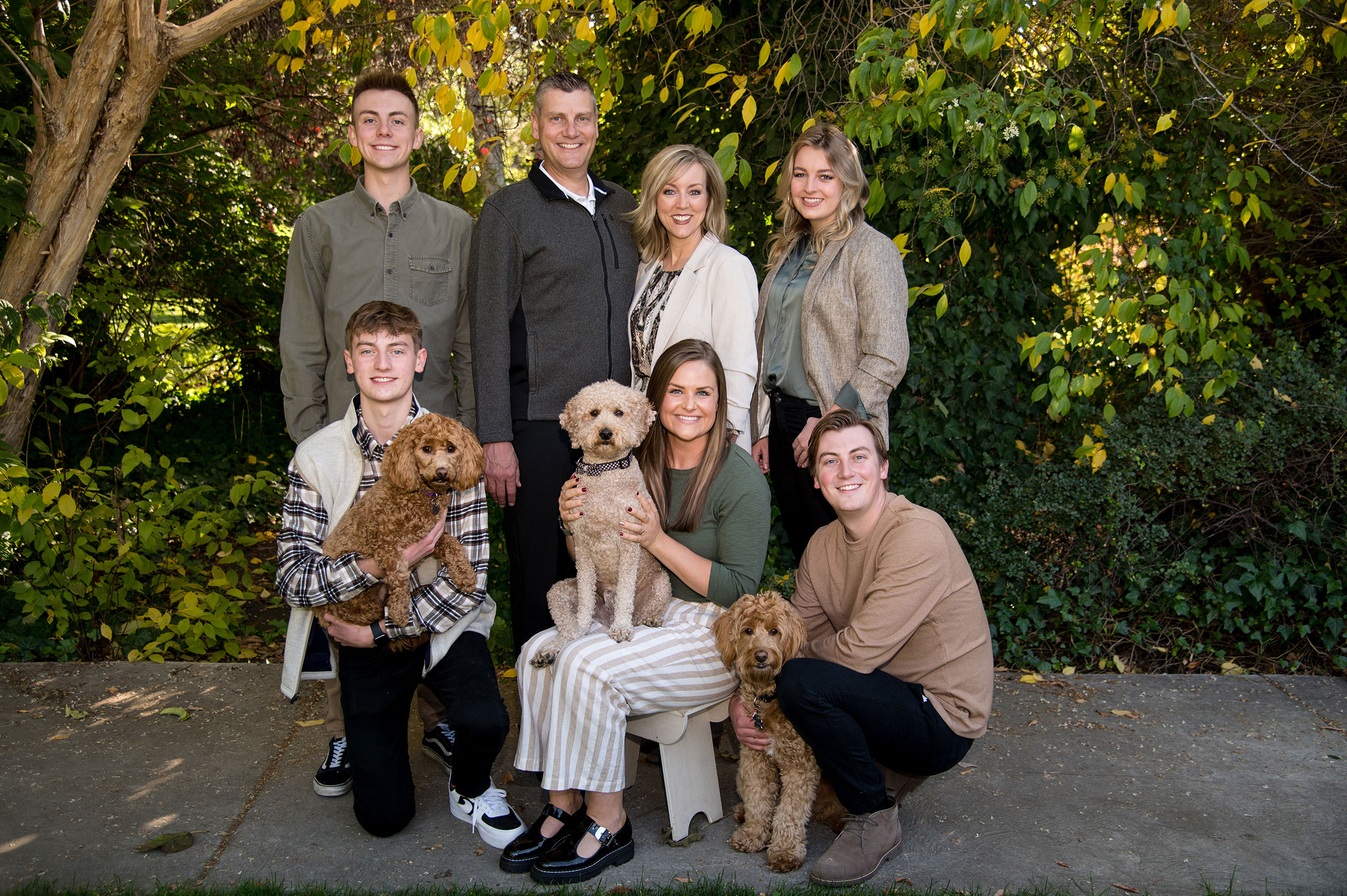 Aimee Winder Newton et al. posing for a photo with dogs.