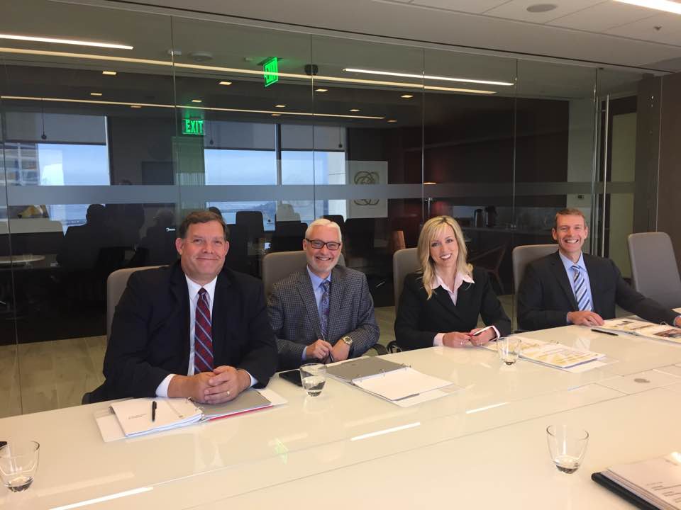 A group of people sitting at a table.