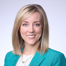 A close-up of Aimee Winder Newton smiling.