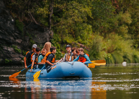 A group of people in a canoe.