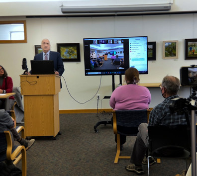 A person giving a presentation to a group of people.