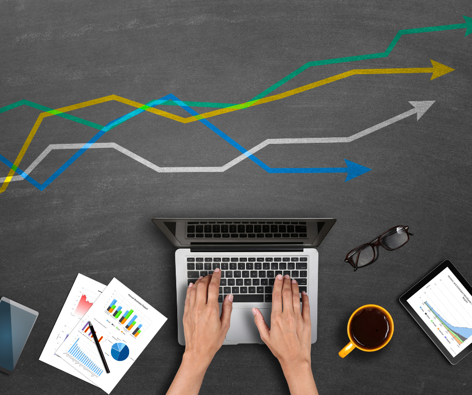 A person's feet on a laptop.