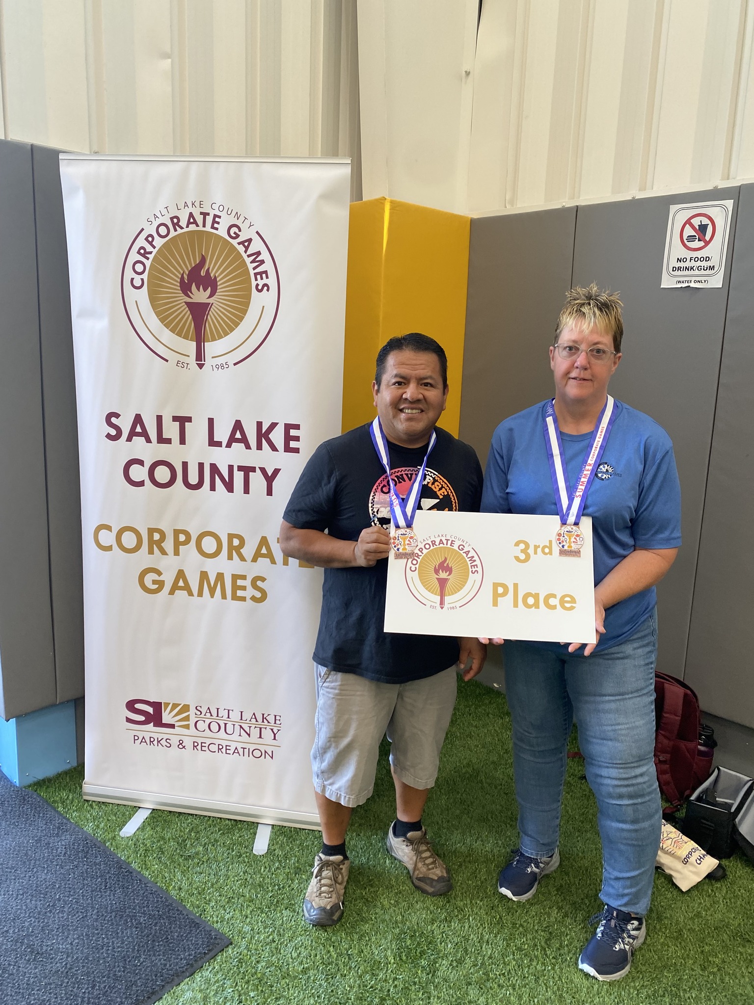 Heidi Kratsch et al. holding a sign.