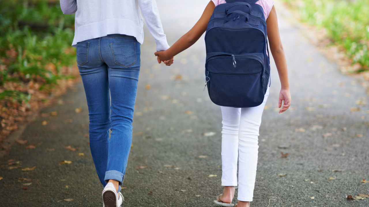 A pair of people holding hands.