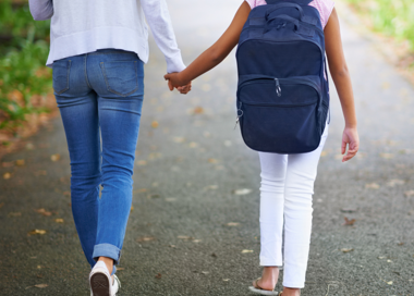 A pair of people holding hands.