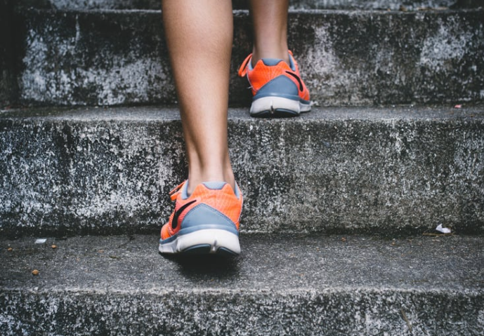 A person's legs and shoes.