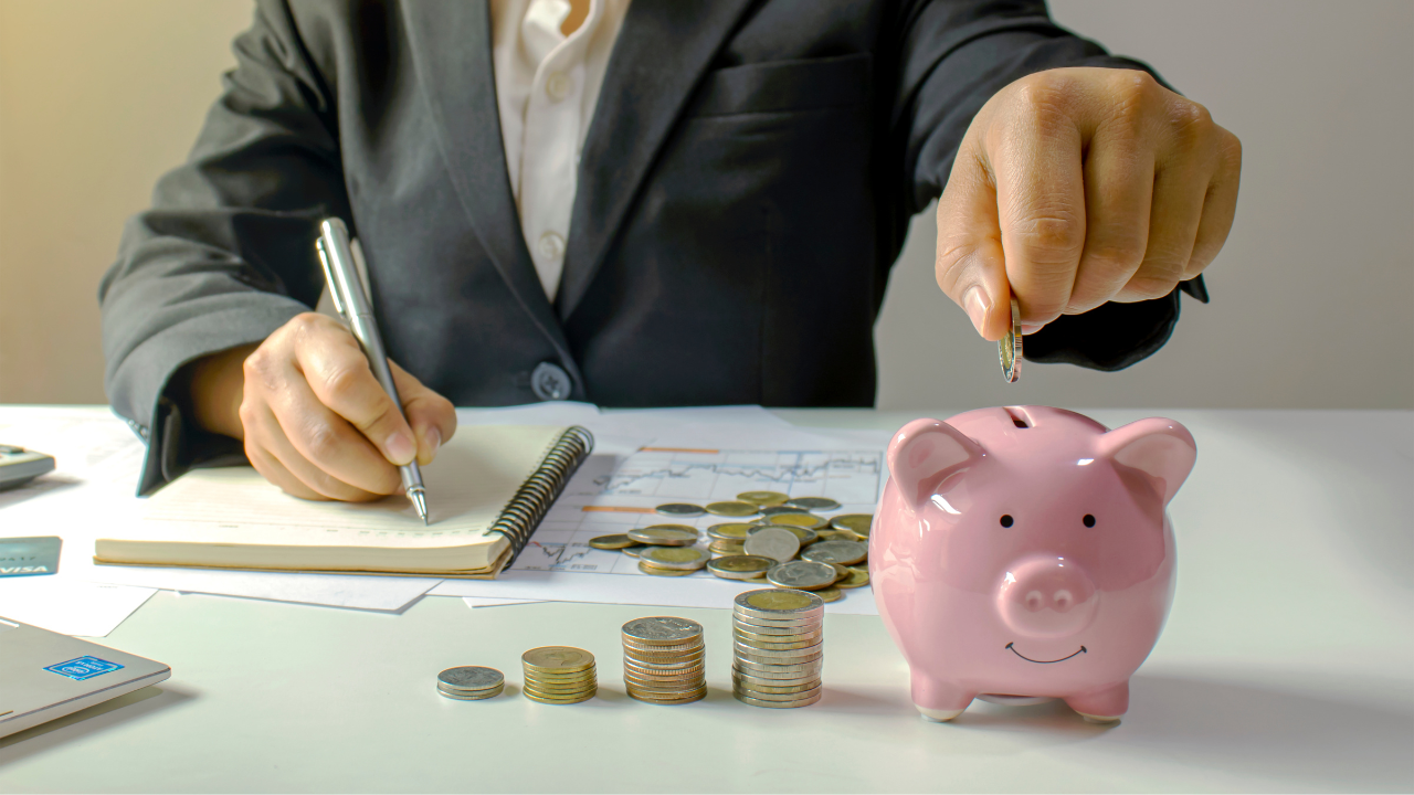 A person writing on a piece of paper.