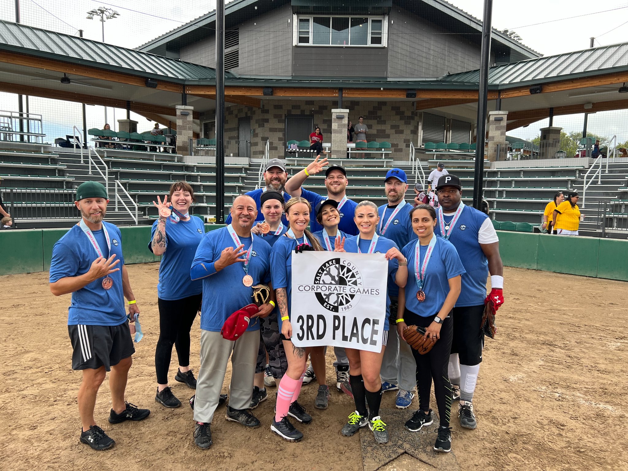 A group of people holding a sign.