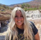 A woman smiling for the camera.