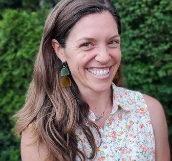 A woman smiling for the camera.