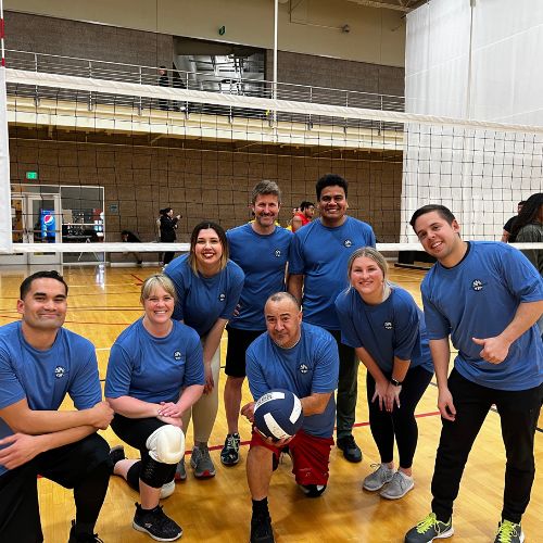 A group of men in blue shirts.