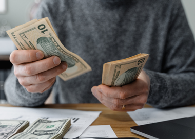A person holding money.