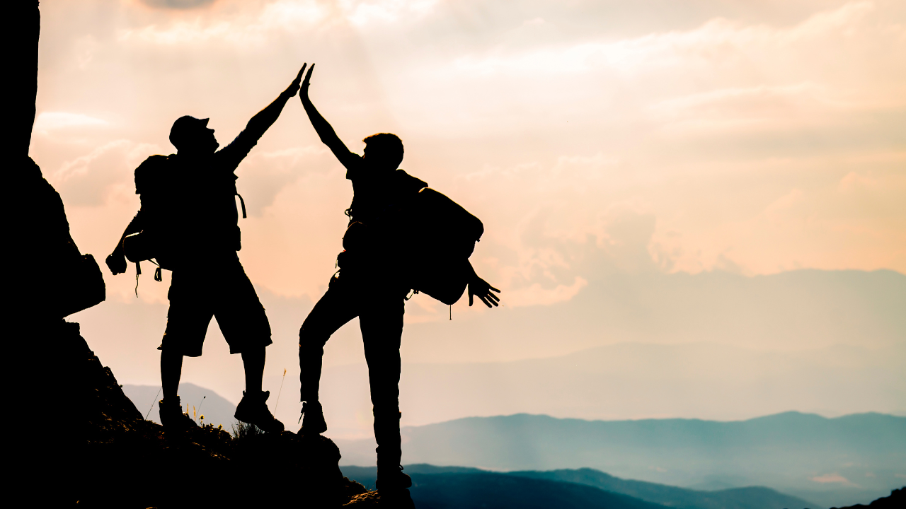 A group of people climbing a mountain.