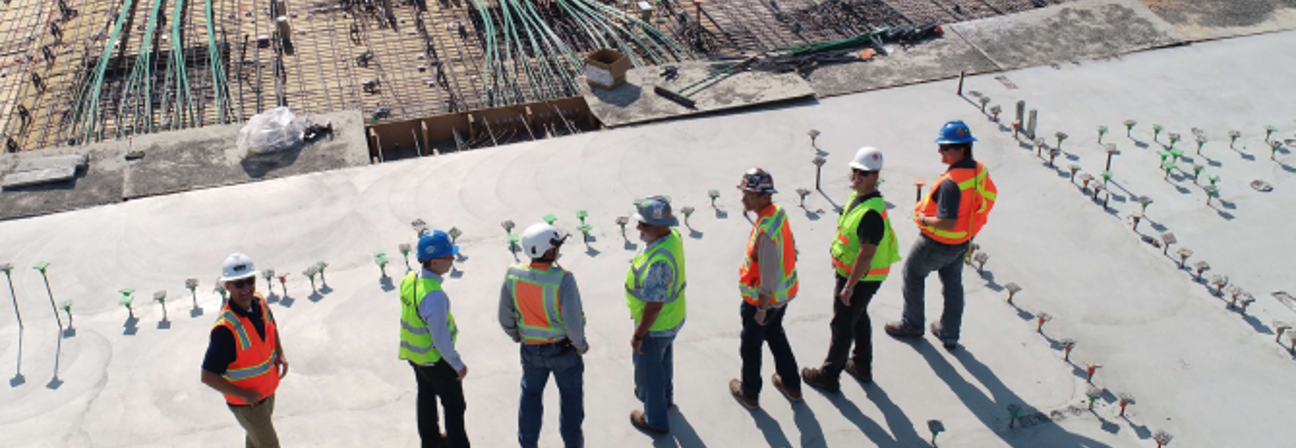 A group of people standing on a snowy hill.