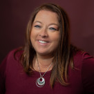 A woman smiling for the camera.