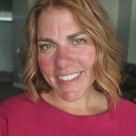 A close-up of a person smiling.