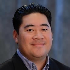 Jake Fitisemanu Jr smiling for the camera.